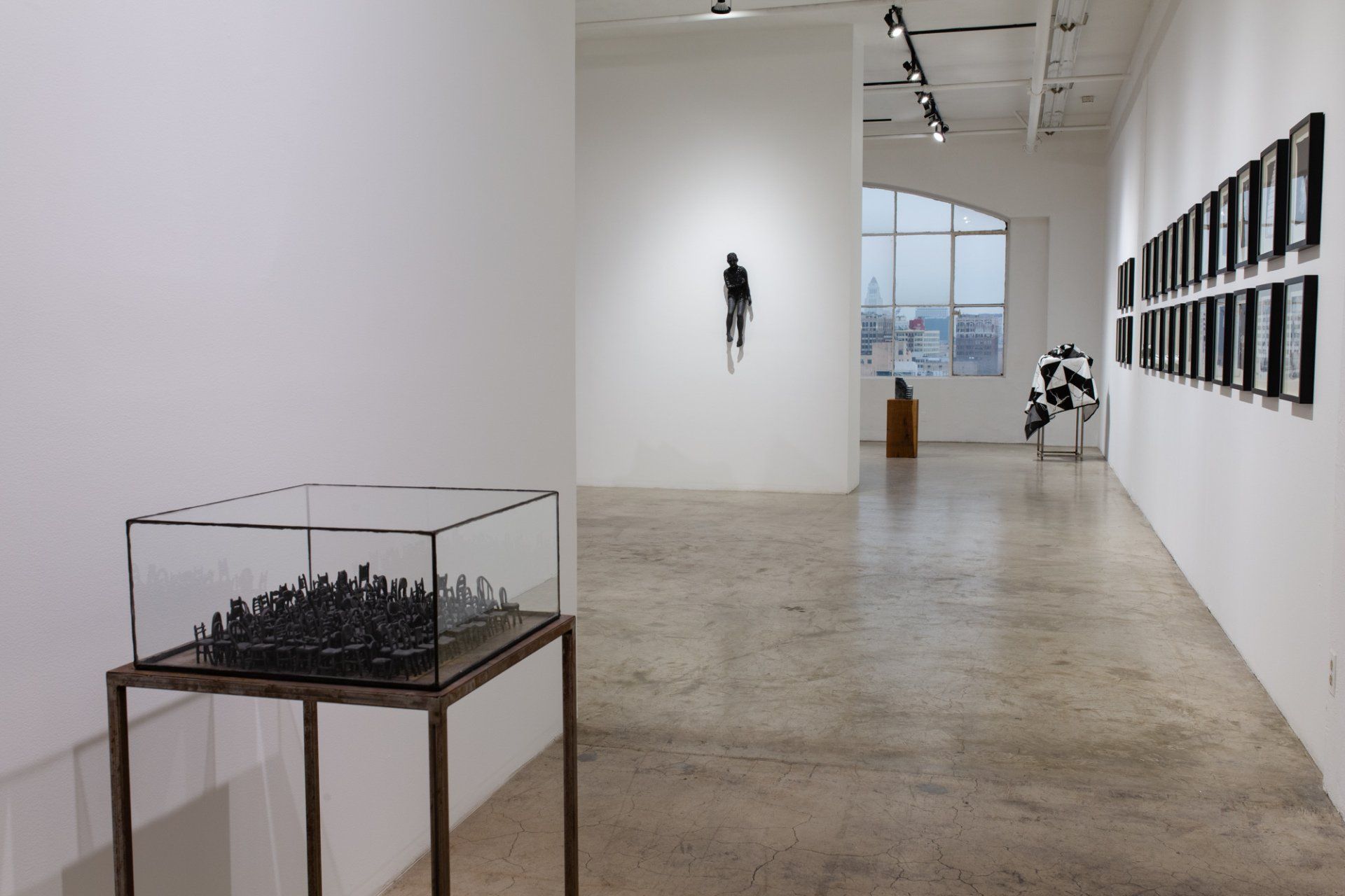 A large room with a glass display case in the middle