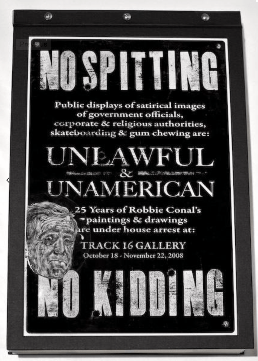 A sign that says no spitting on it