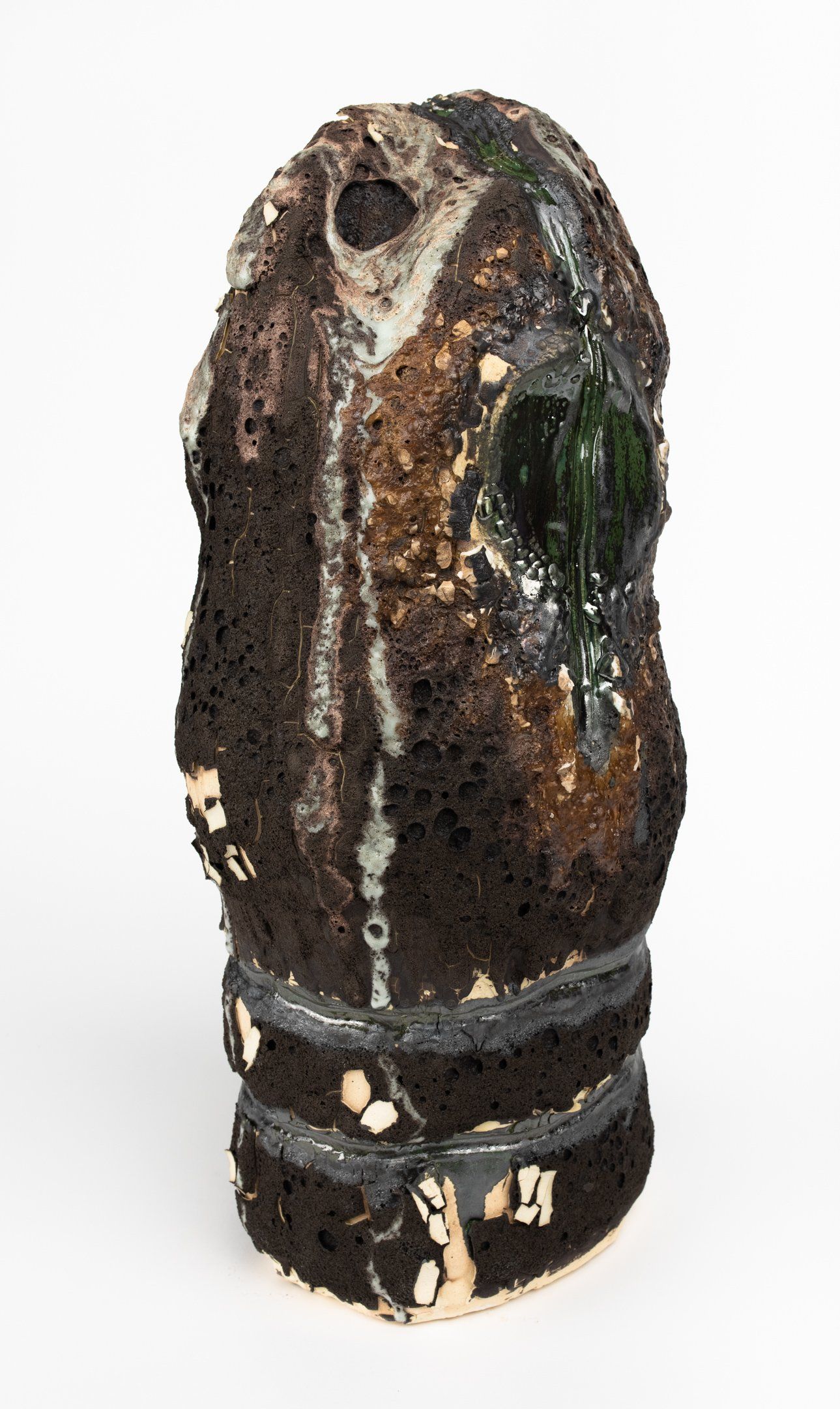 A close up of a sculpture on a white background.