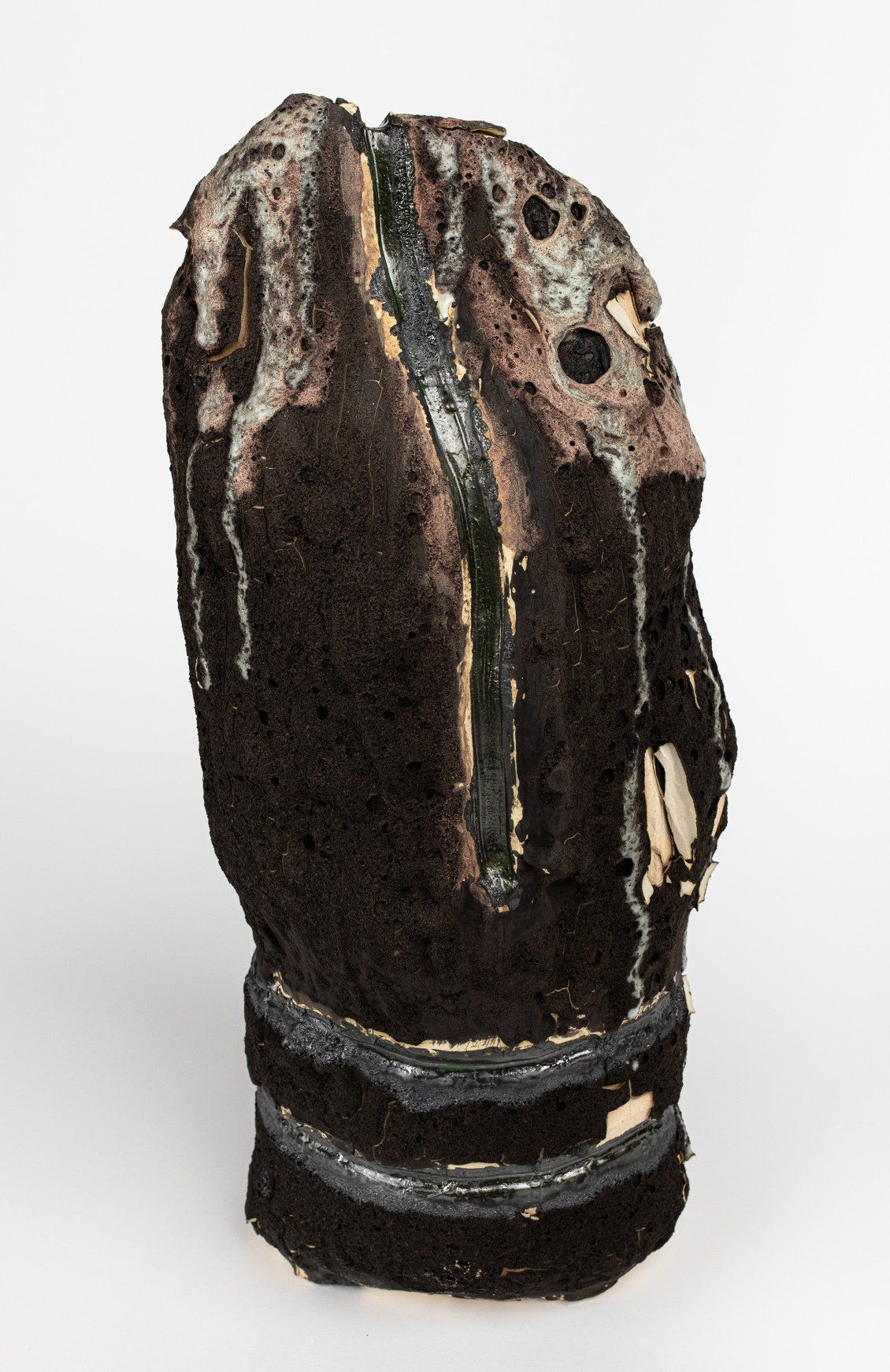 A close up of a sculpture on a white surface