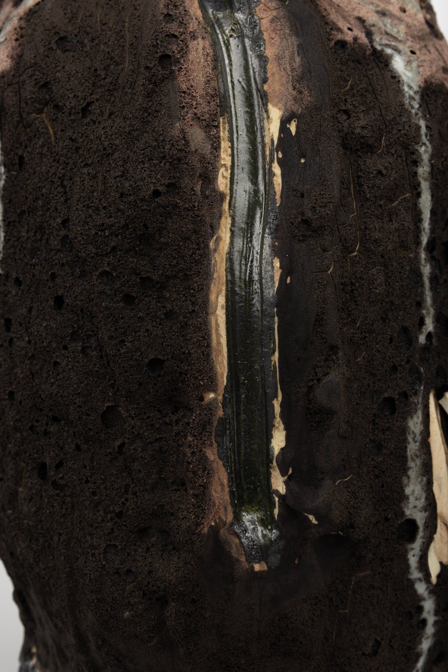 A close up of a chocolate cake with a waterfall in the middle.