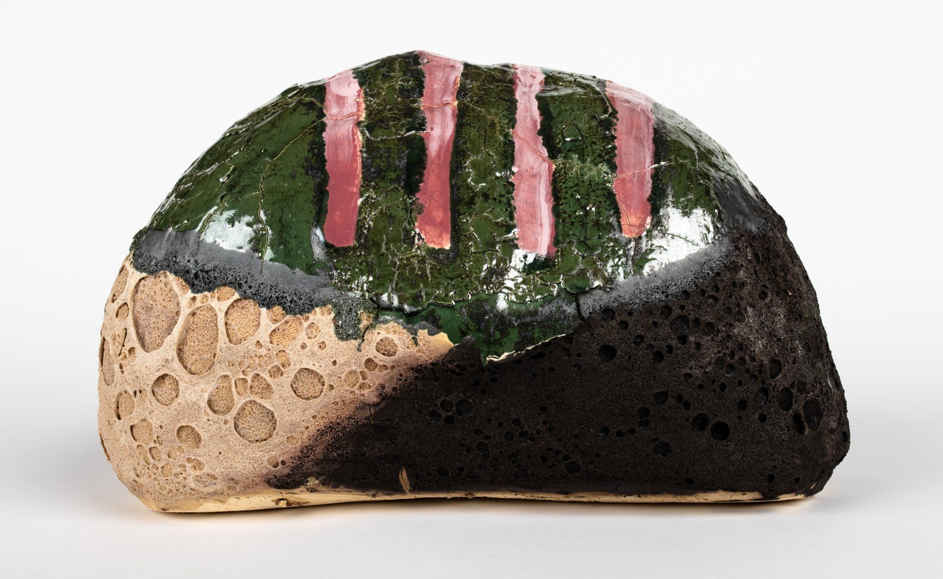 A piece of bread with green and pink stripes on it