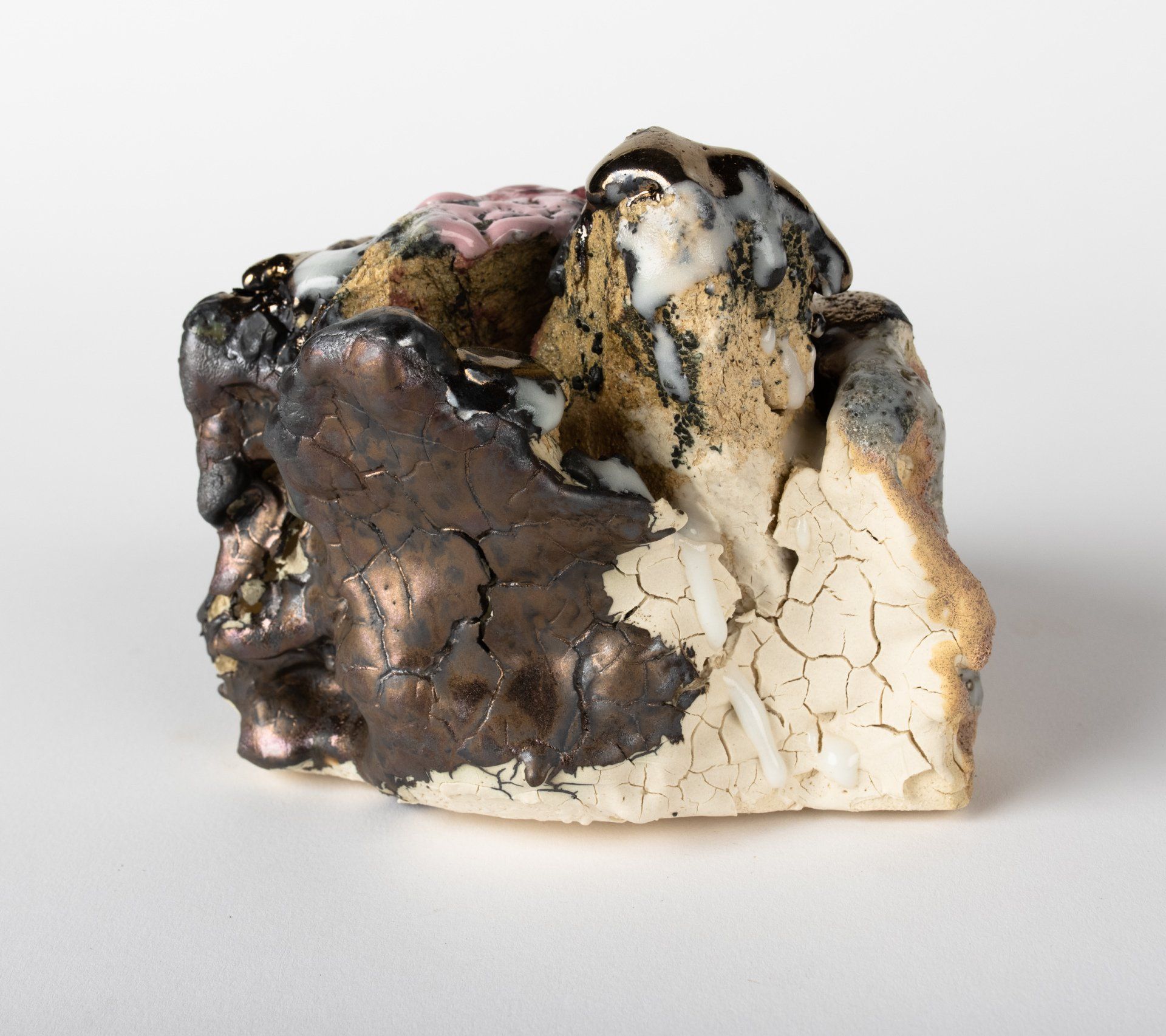 A close up of a piece of rock on a white surface