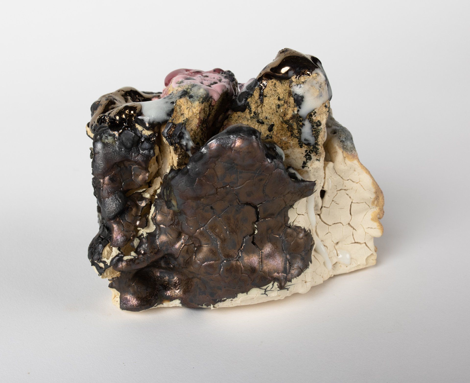 A close up of a piece of rock on a white surface