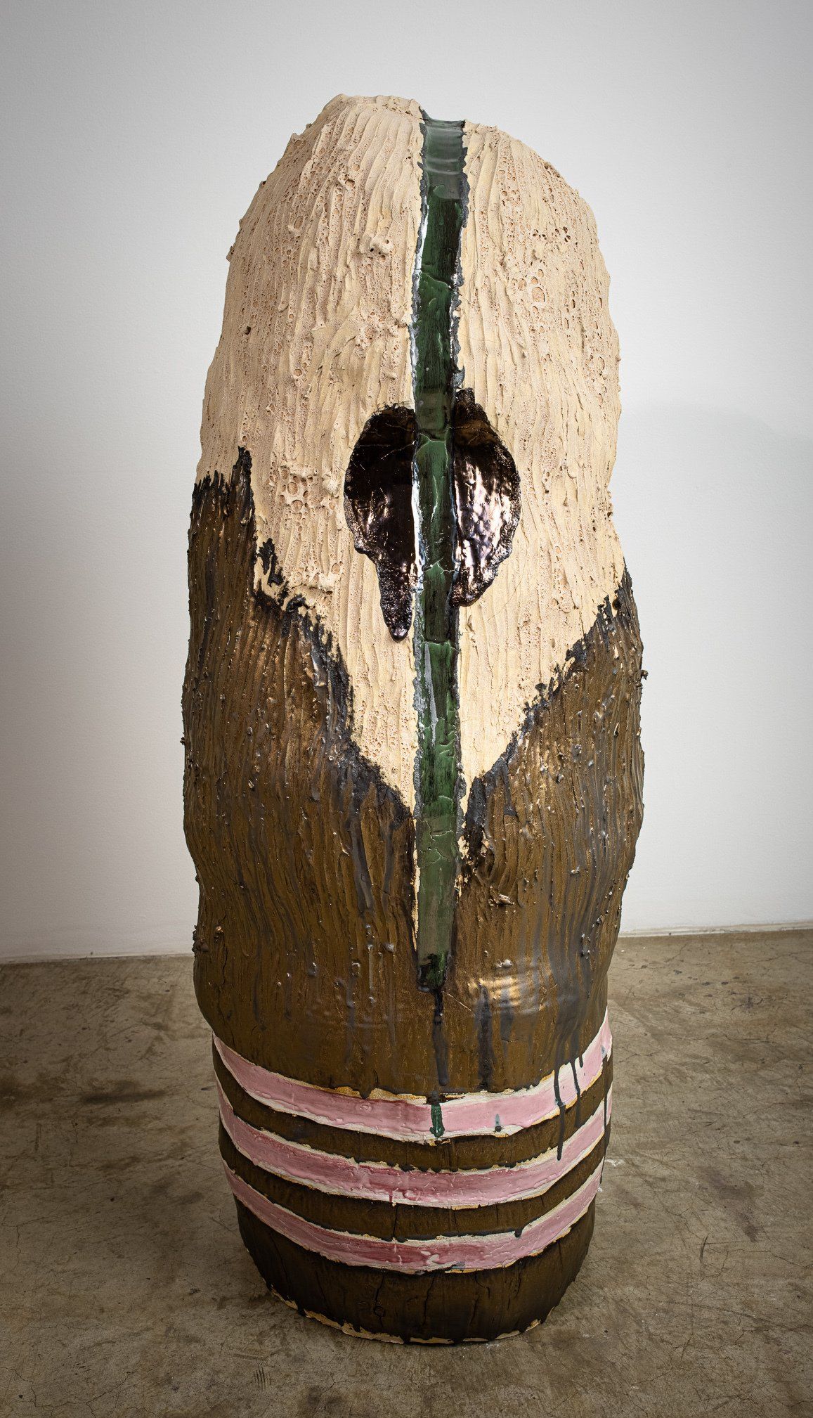A ceramic sculpture is sitting on top of a wooden table.
