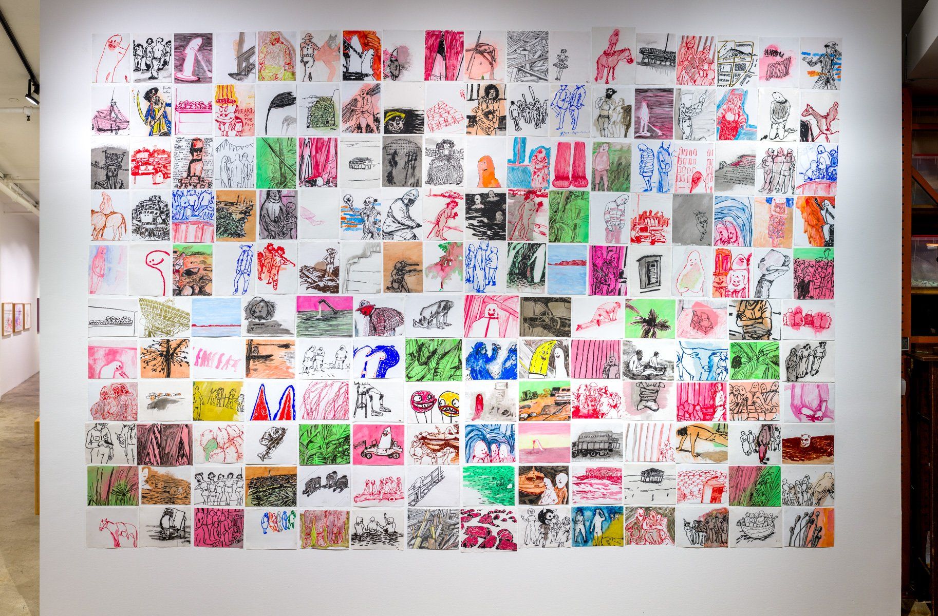 A wall with a lot of colorful pictures on it.