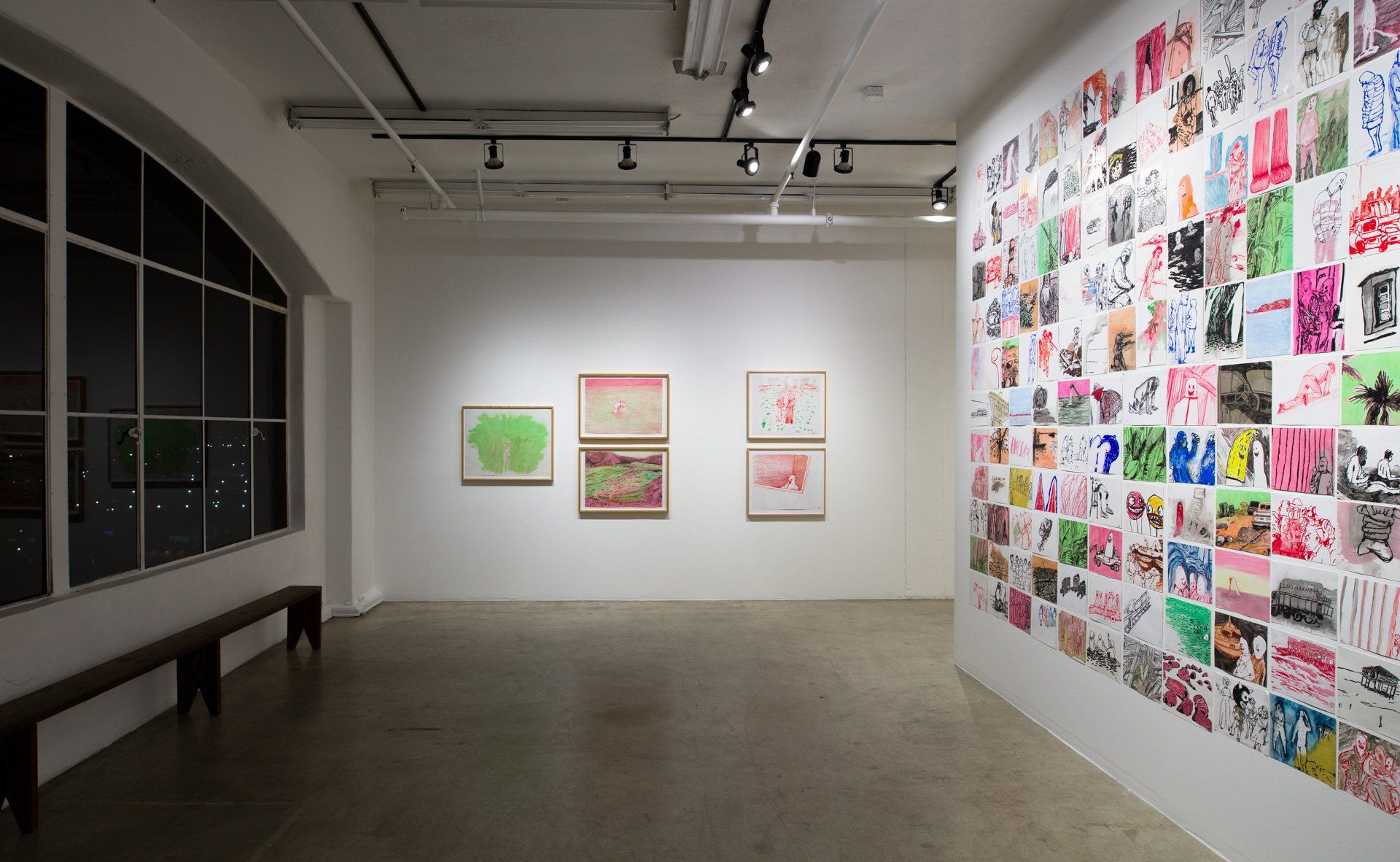 A large room with a lot of paintings on the wall.