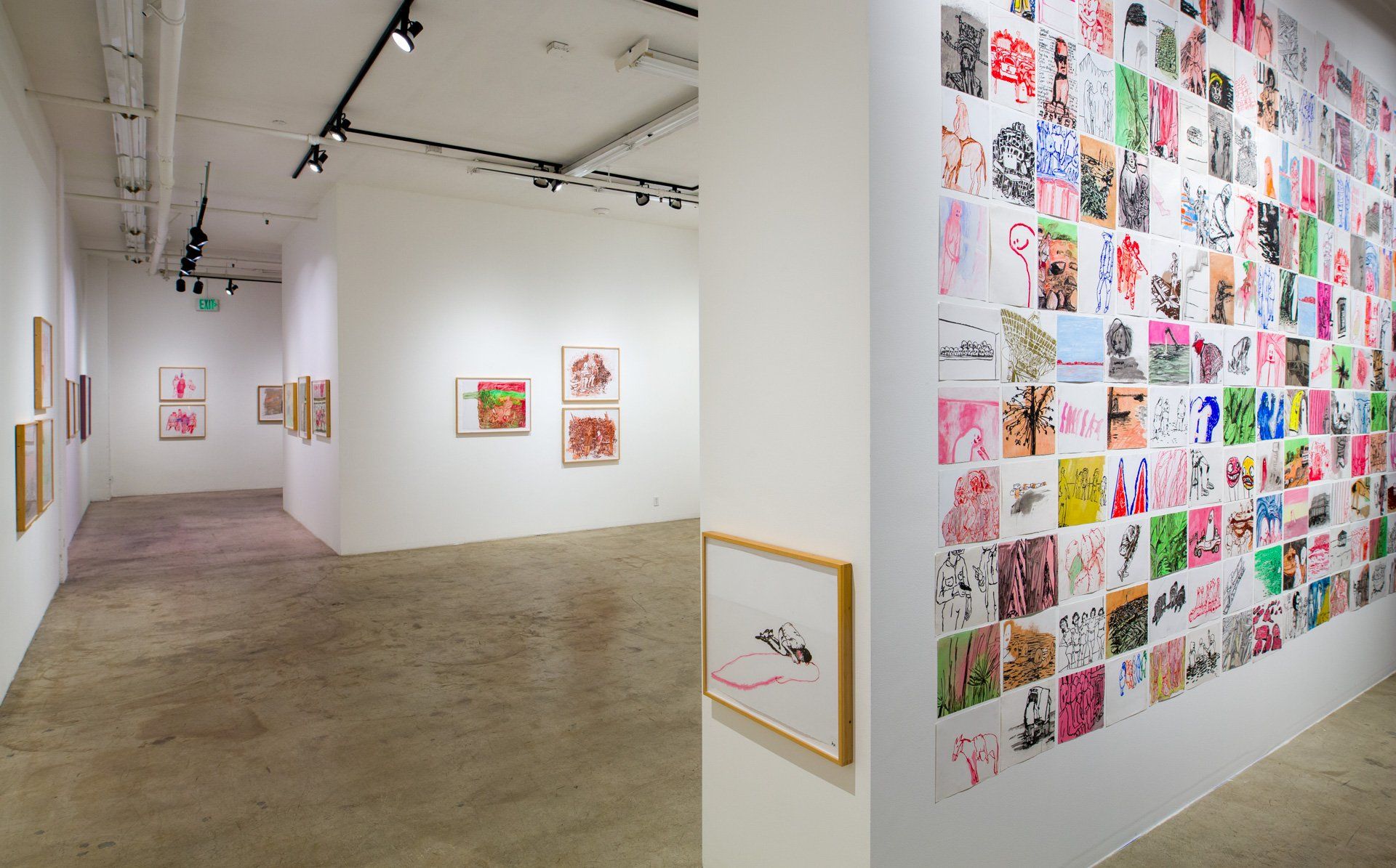 A large room with a lot of paintings on the wall