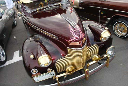 A very old car with a license plate that says ' a ' on it