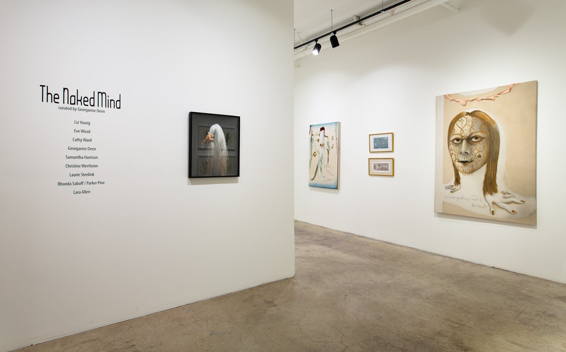 A room with paintings on the wall and a sign that says the headmind