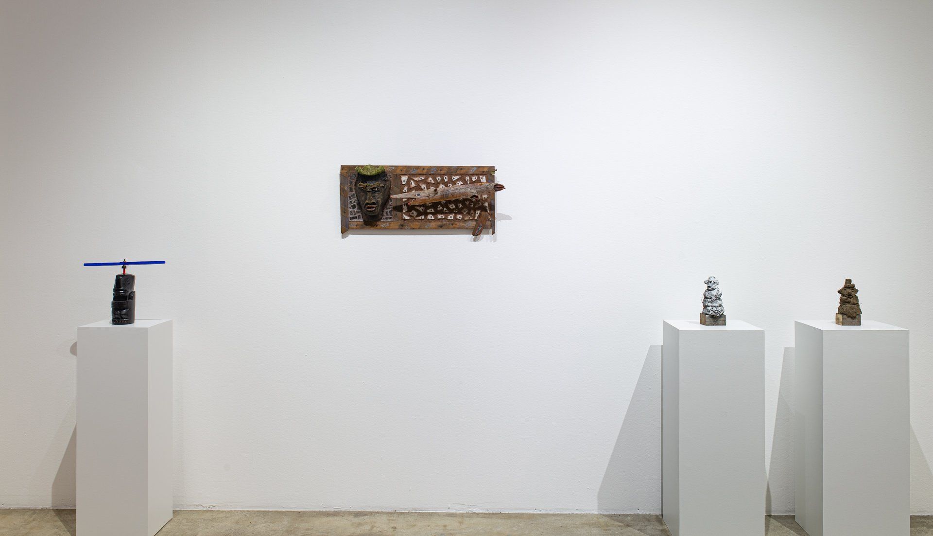 There are a lot of sculptures on display in this room.