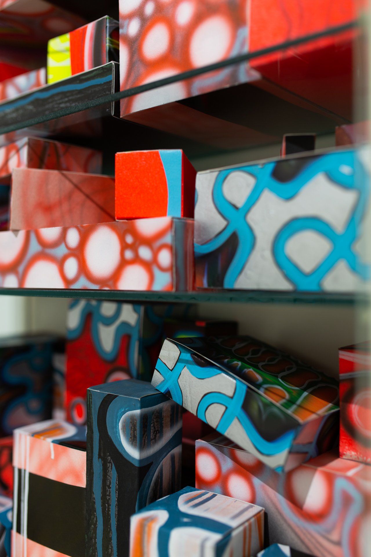 A bunch of colorful boxes are stacked on top of each other