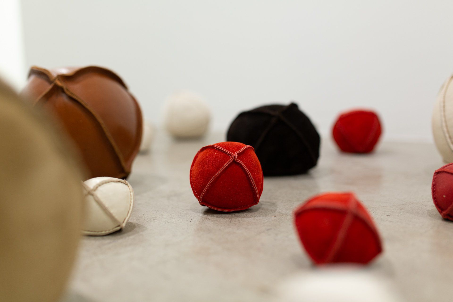 A group of balls of different colors are sitting on a table.