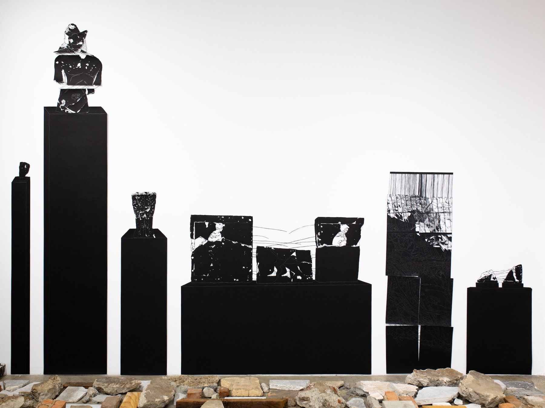 A silhouette of a city skyline is on a wall