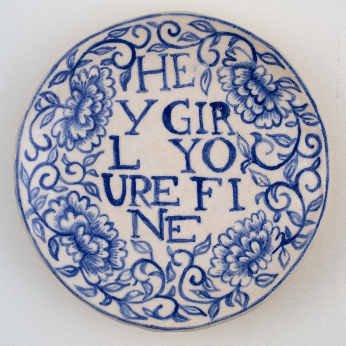 A blue and white plate with the words