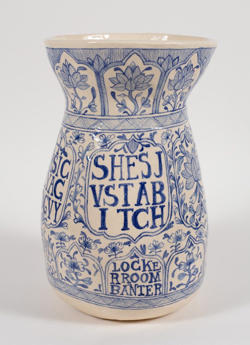 A blue and white vase that says shes vstab itch