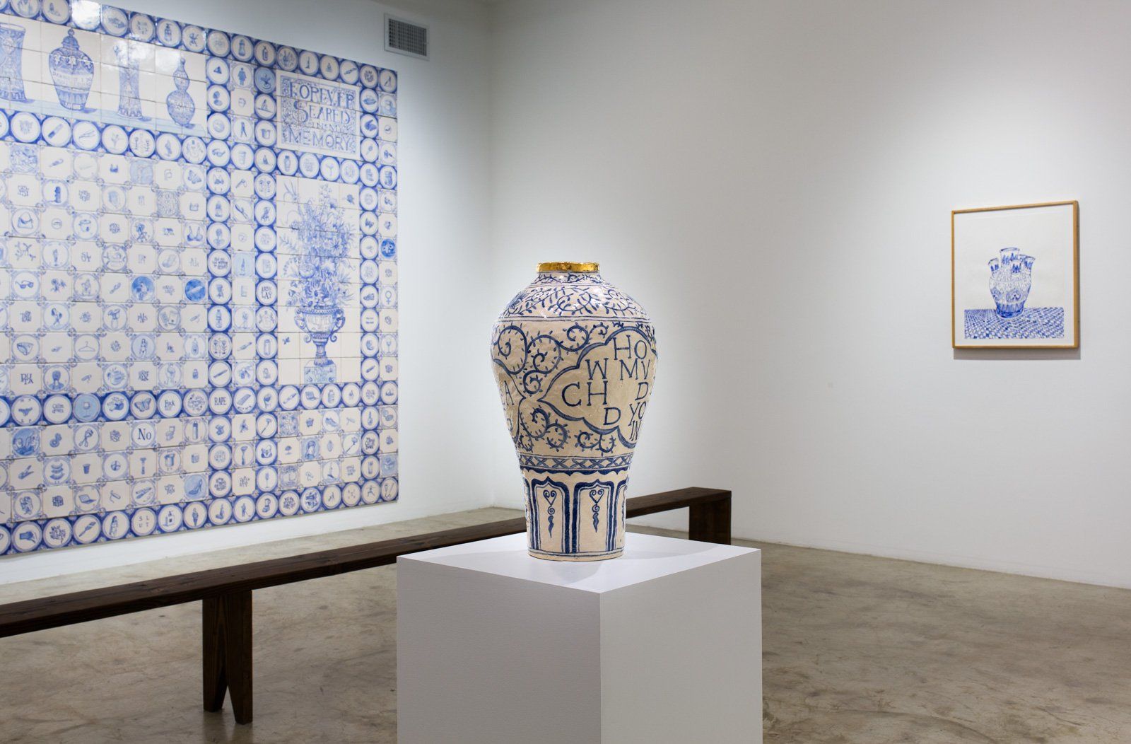 A blue and white vase is on display in a museum.