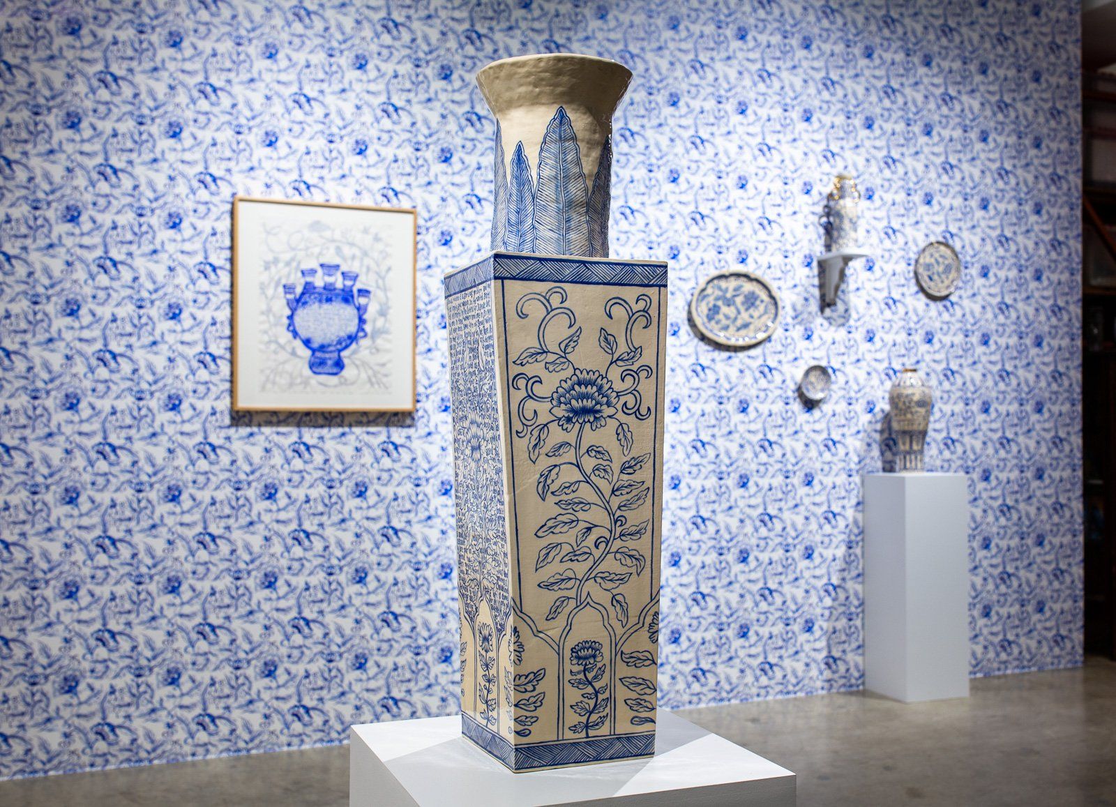 A large blue and white vase is on display in a museum.