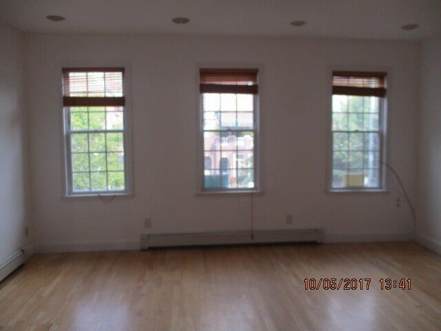 Empty apartment with 3 windows — Real Estate Agent in Forest Hills, NY Empty apartment with 3 windows — Real Estate Agent in Forest Hills, NY