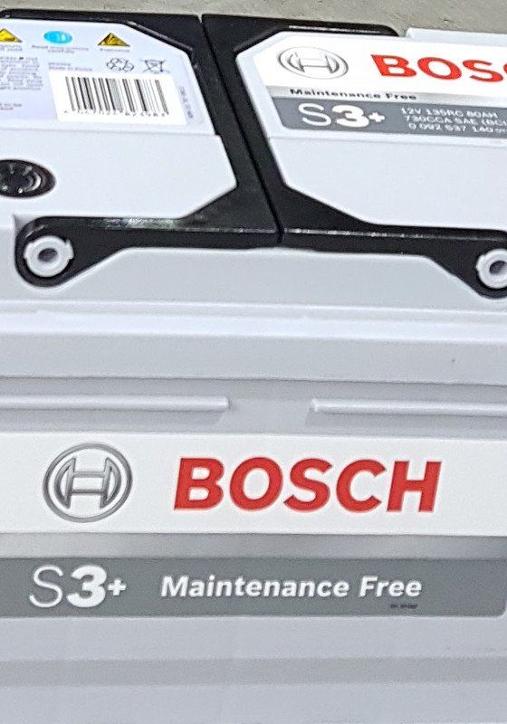A close up of a bosch battery that is maintenance free