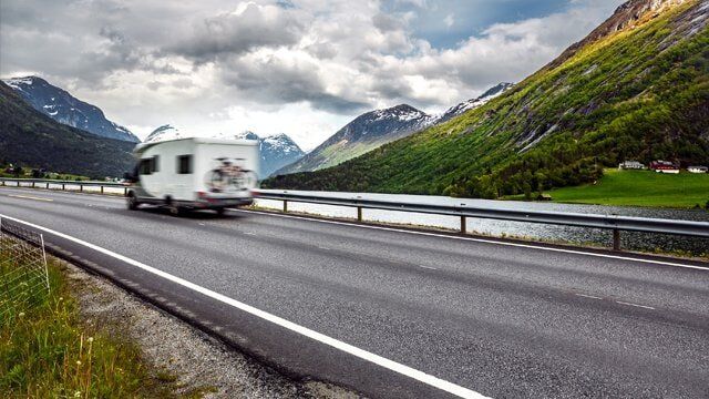 Caravan Car Travels On The Highway — RV Parking in Peroria, IL Caravan Car Travels On The Highway — RV Parking in Peroria, IL