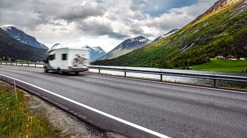 Caravan Car Travels On The Highway — RV Parking in Peroria, IL Caravan Car Travels On The Highway — RV Parking in Peroria, IL