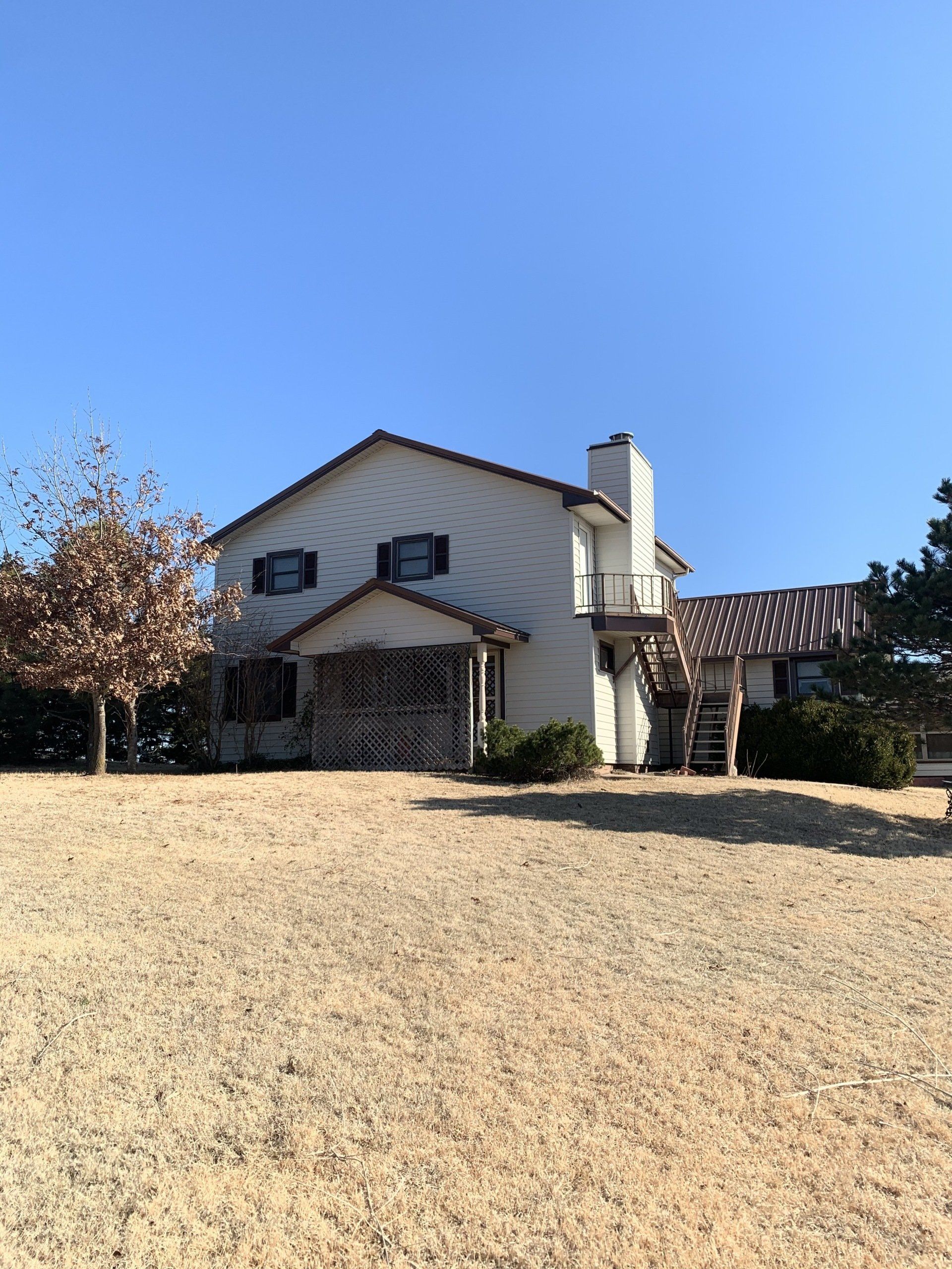remodeled house with beige siding
