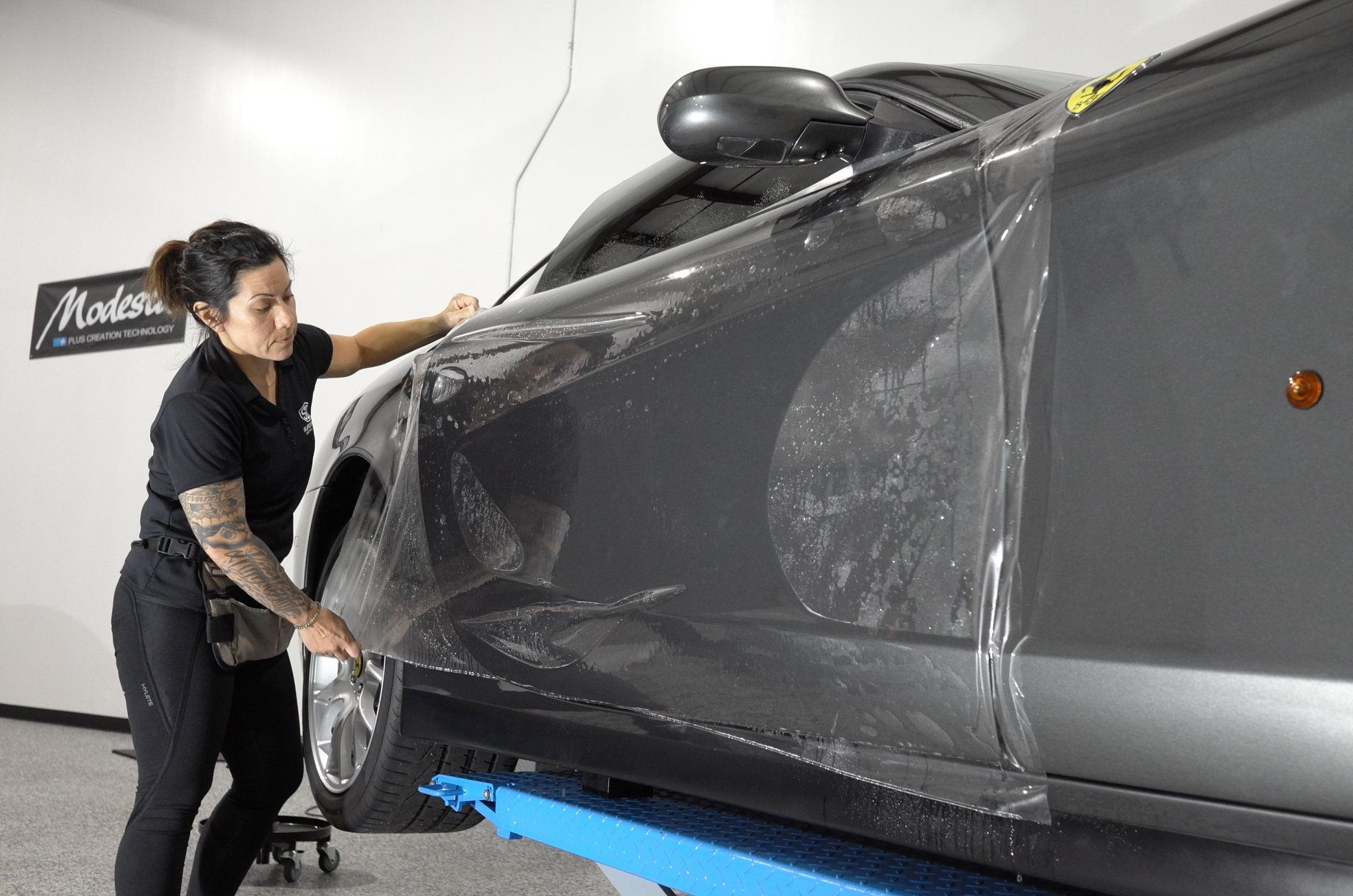 Kim Giramma applying ppf to a Ferrari 612