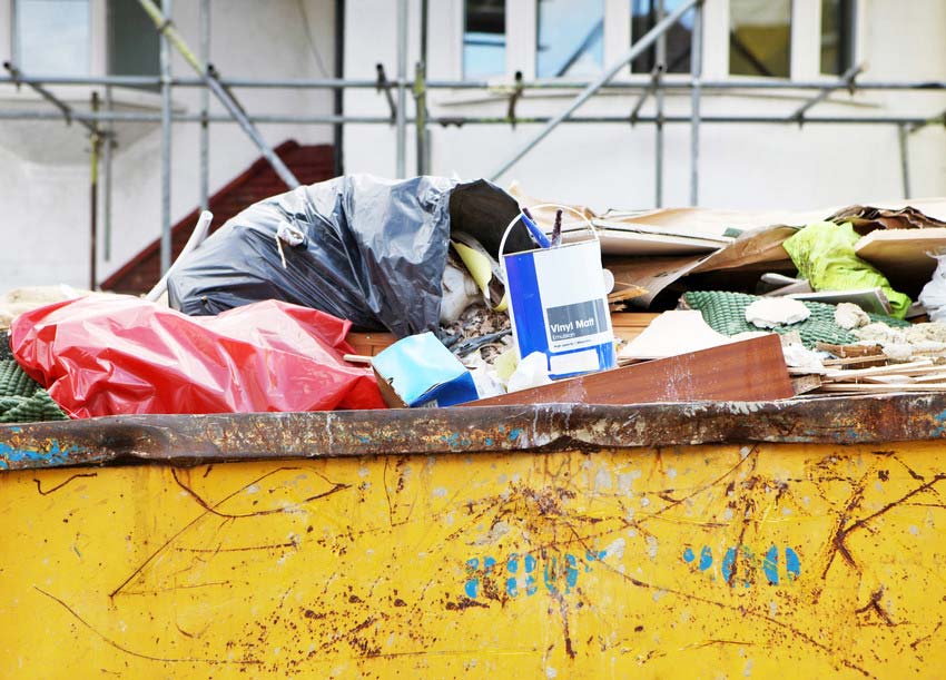 Full skip in front of house renovation.