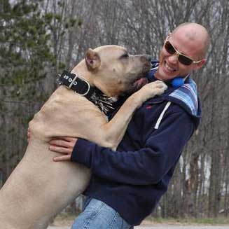 Concrete Contractor and his dog playing in Traverse City, MI