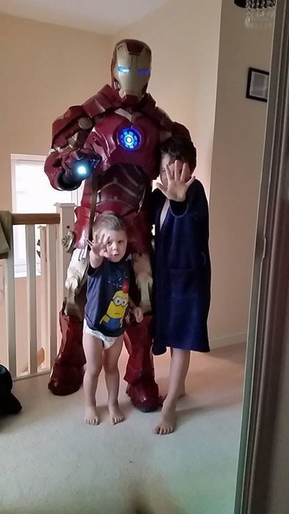 Kids with a man in a iron man