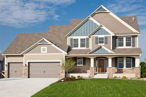 Boothbay blue siding with beige accents and arctic white trim.