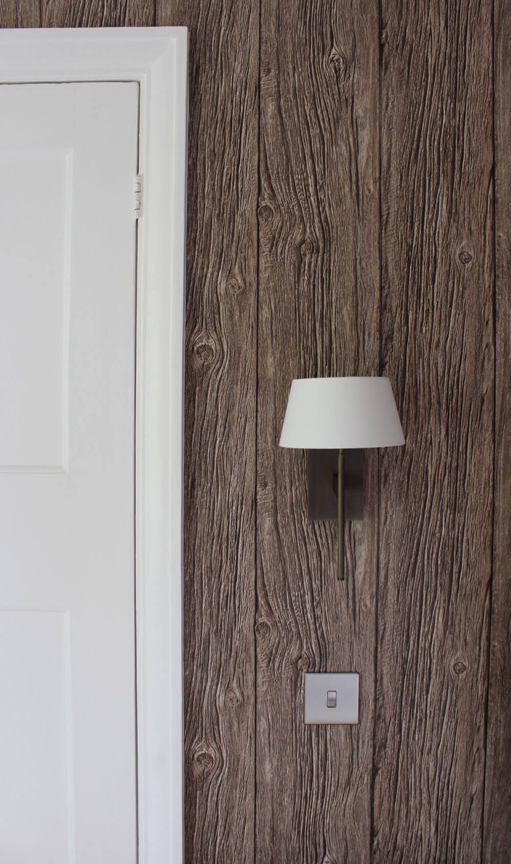 artistic photo with a white door and a wooden wall