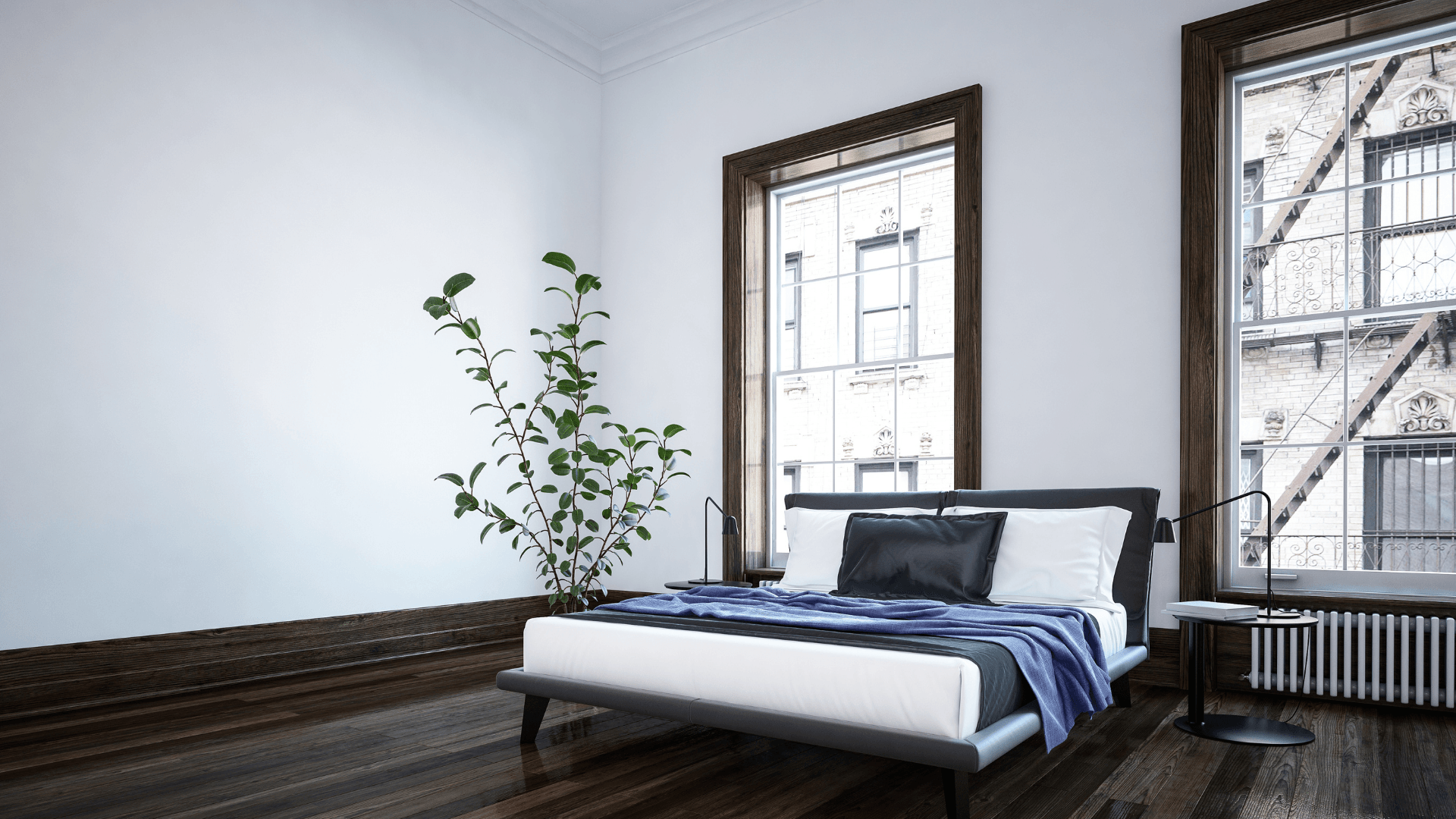 This is a picture of new sliding windows in a bedroom.  The windows are tall and offer a lot of natural light into the bedroom. 
