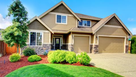 This is a picture of a house with new replacement windows. The windows are casement windows and bay windows. There's also a picture of a new front entry door.