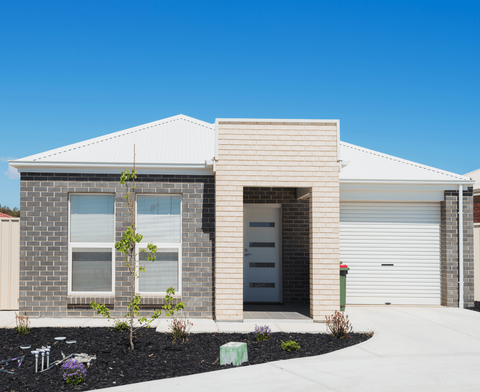 Picture of a white front door.  The door has a very modern look with frosted glass windows.