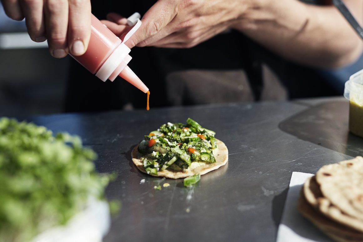 A fish taco made from farm-raised perch whose poop fertilises fruit and veg within the Space10 project.