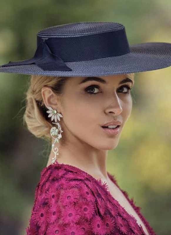 woman with pink outfit and black hat