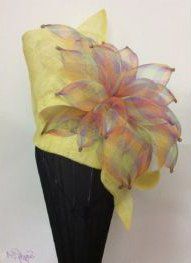 yellow hat with rainbow ribbon
