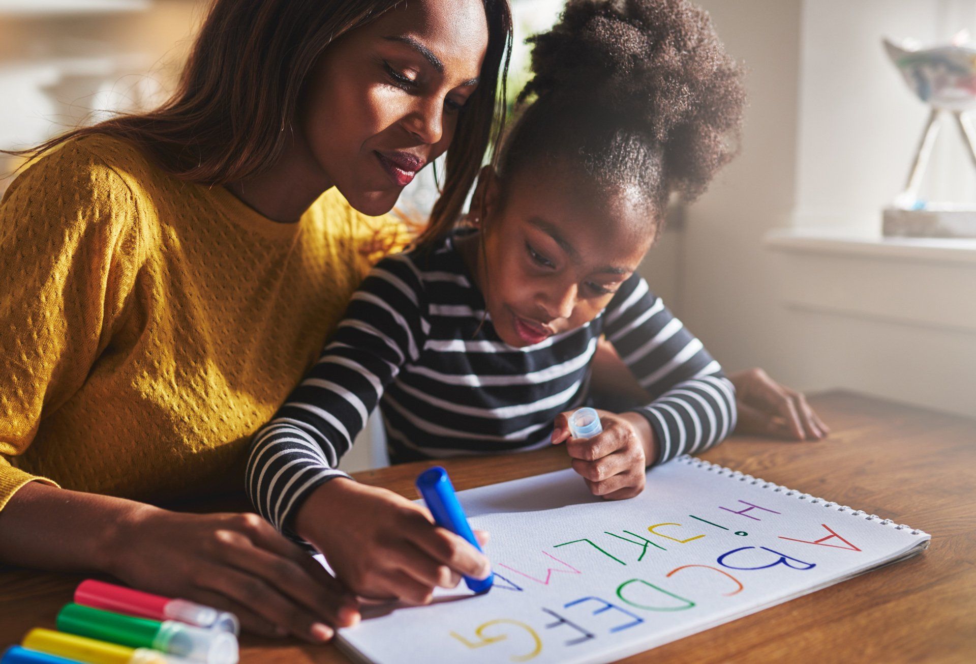 Mother with child coloring