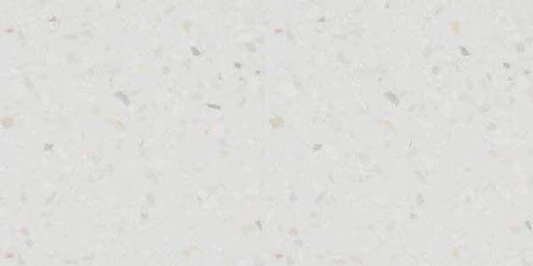 Light gray countertop material with a fine, speckled pattern of white and tan flecks.