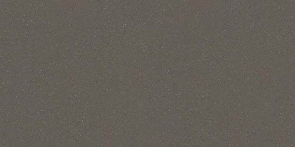 A solid, uniform surface of matte, dark gray stone or granite with a fine, speckled texture.