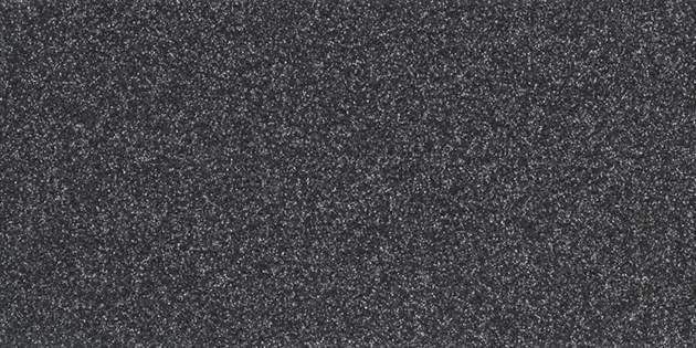A close-up, textured surface in a dark charcoal grey color.