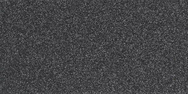 A close-up texture of dark grey, coarse, flecked material resembling sandpaper or industrial carpet.