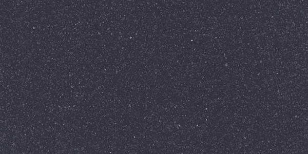 A solid, dark charcoal gray surface with a fine, speckled, matte texture.