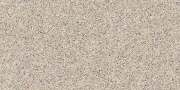 A textured surface with a light beige, speckled pattern, resembling granite or stone material.