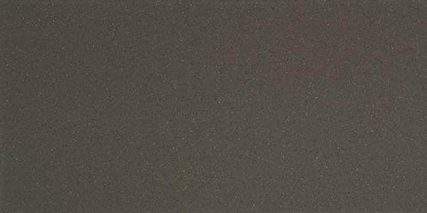 A solid, dark charcoal gray texture with a fine, matte grain.
