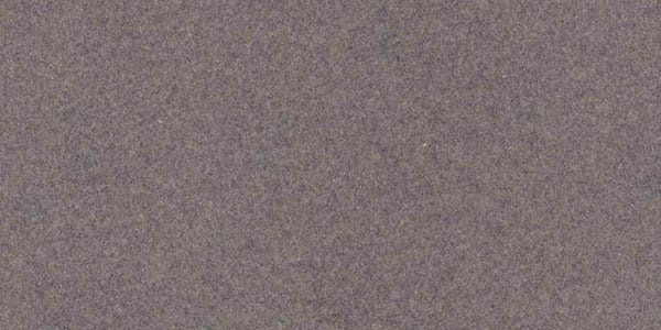 A uniform, solid-textured background in a muted, desaturated grayish-purple tone.