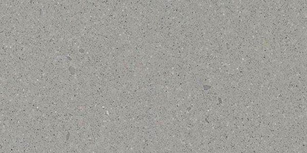 A seamless background texture of solid, medium-gray engineered stone or concrete with fine, scattered flecks.