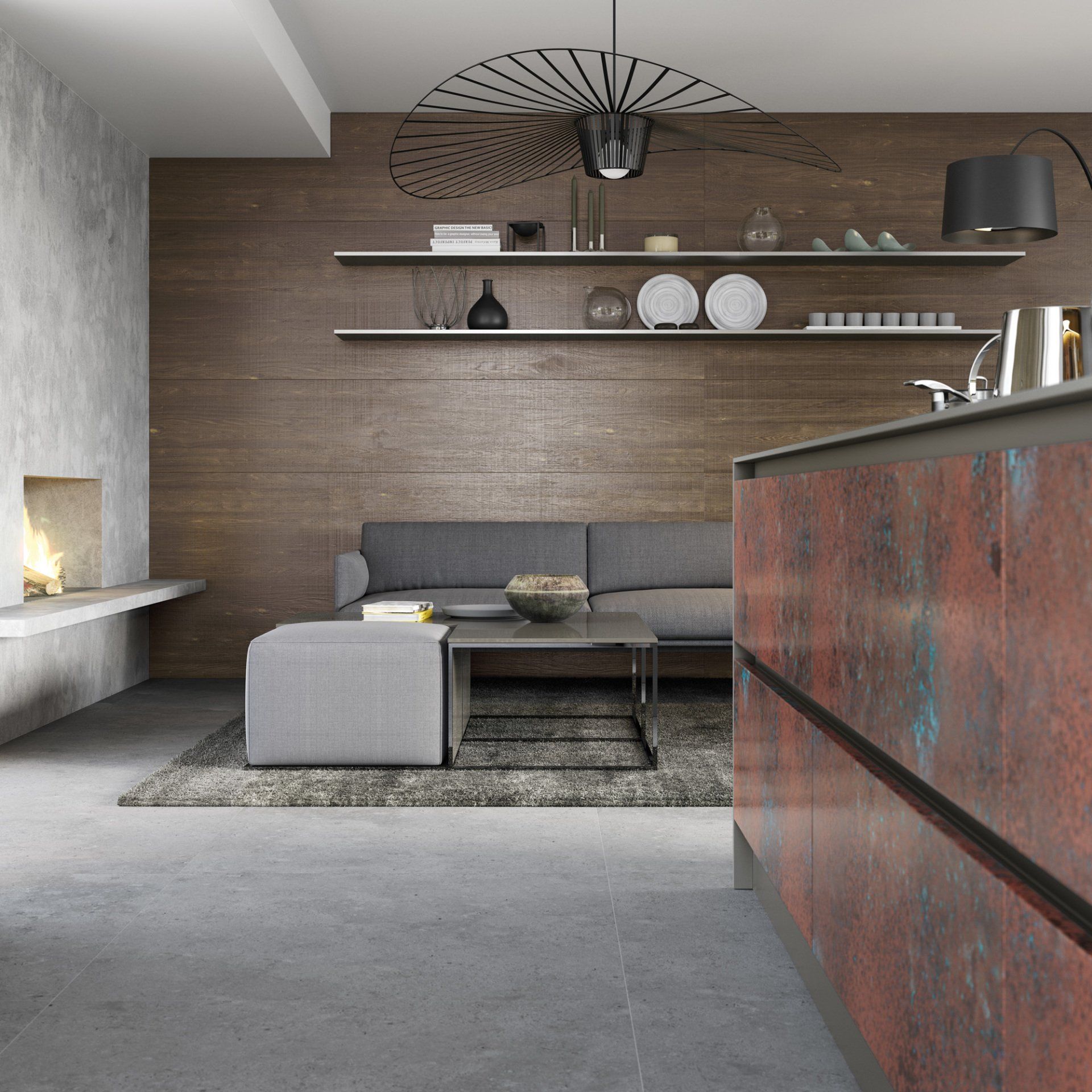 A modern living area featuring a rustic-style kitchen island, grey sofa, stone fireplace, and wood-paneled walls.